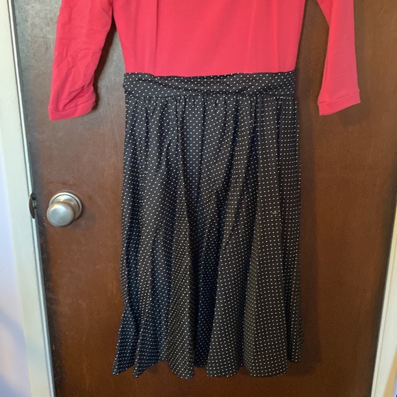 Pinup girl clothing is dress with pink too and black and polka dot skirt - Picture 4 of 5